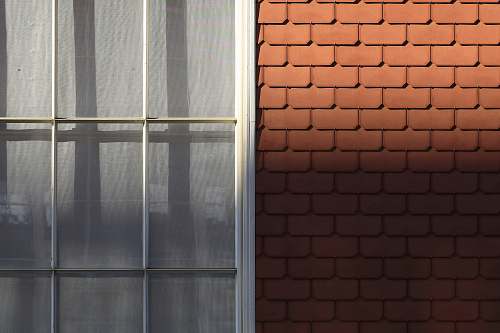 home decor white framed window during daytime brick